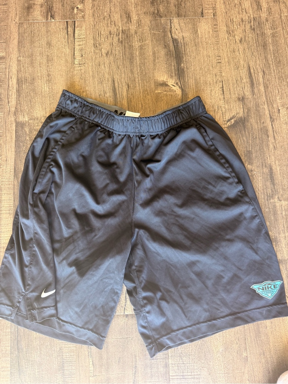 Nike Men's Dark Gray Athletic Shorts with Teal Logo